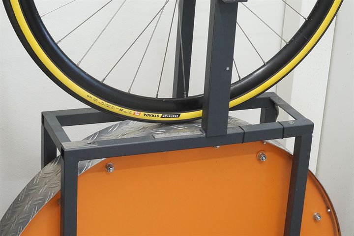 Challenge Strada Pro HTLR 28 road bike tire on a rolling resistance test machine