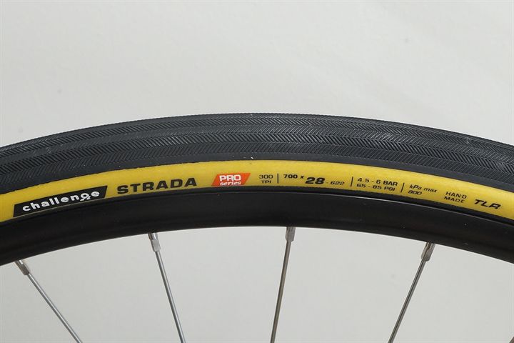 Challenge Strada Pro HTLR 28 road bike tire on a rolling resistance test machine