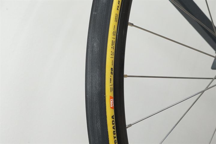 Challenge Strada Pro HTLR 28 road bike tire on a rolling resistance test machine