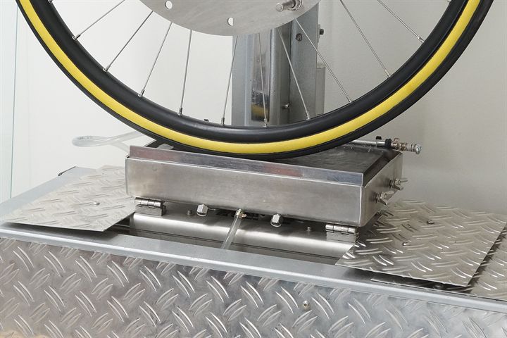 Challenge Strada Pro HTLR road bike tire on a grip test machine