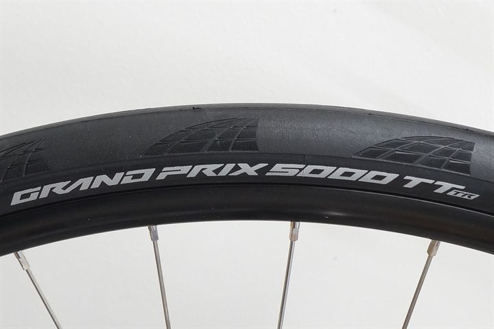 Continental Grand Prix 5000 TT TR 30 road bike tire on a rolling resistance test machine