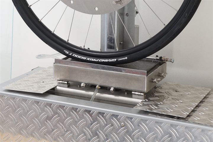Continental Grand Prix 5000 TT TR road bike tire on a grip test machine