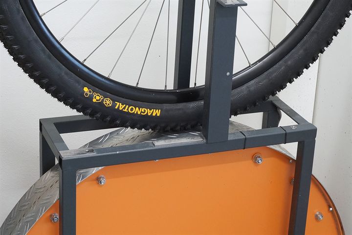 Continental Magnotal Trail Grip road bike tire on a rolling resistance test machine