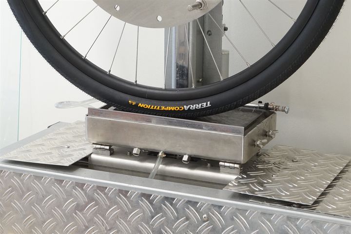 Continental Terra Competition Trail Grip road bike tire on a grip test machine