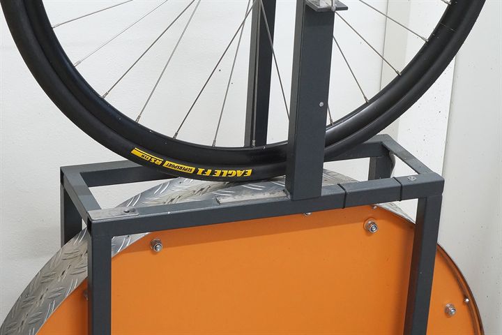 Goodyear Eagle F1 SuperSport RS TLR 28 road bike tire on a rolling resistance test machine