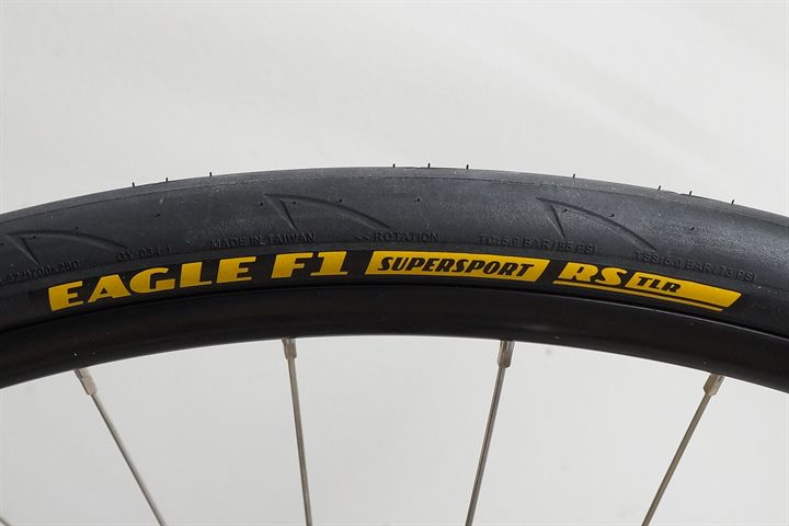 Goodyear Eagle F1 SuperSport RS TLR 28 road bike tire on a rolling resistance test machine