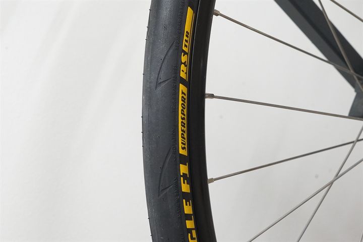 Goodyear Eagle F1 SuperSport RS TLR 28 road bike tire on a rolling resistance test machine