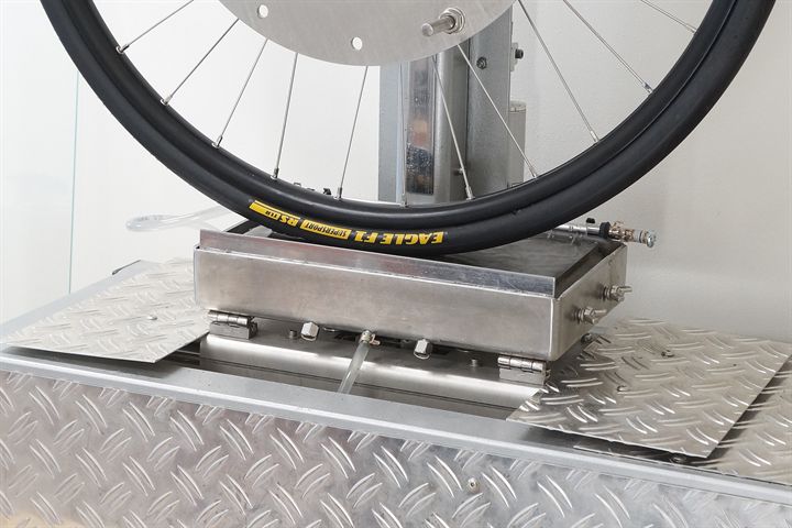 Goodyear Eagle F1 SuperSport RS TLR road bike tire on a grip test machine