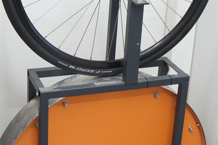 Pirelli P Zero Race TLR SpeedCore 30 road bike tire on a rolling resistance test machine