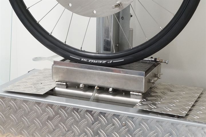 Pirelli P Zero Race TLR SpeedCore road bike tire on a grip test machine