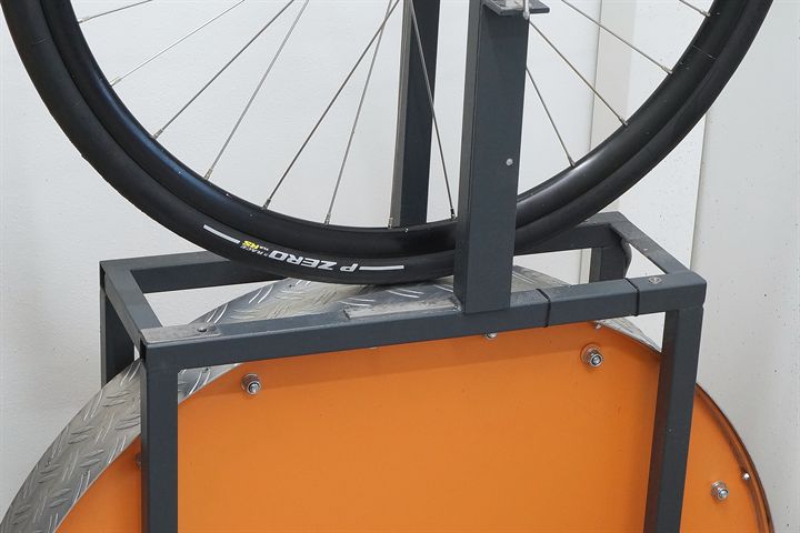 Pirelli P Zero Race TLR RS SpeedCore 30 road bike tire on a rolling resistance test machine