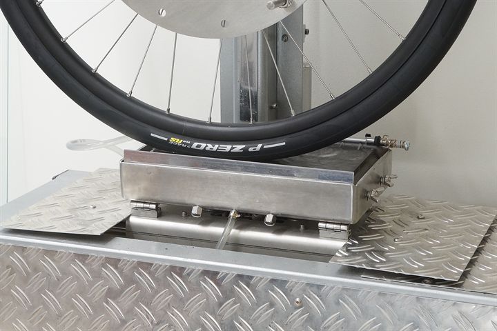 Pirelli P Zero Race TLR RS SpeedCore road bike tire on a grip test machine