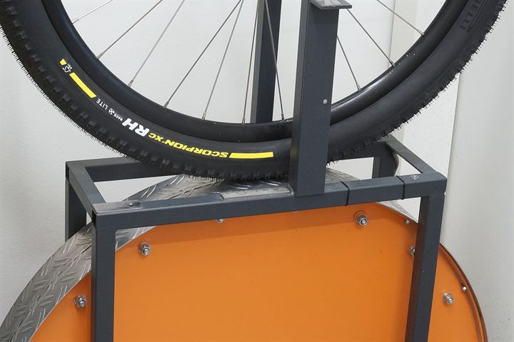 Pirelli Scorpion XC RH Lite Team Edition road bike tire on a rolling resistance test machine