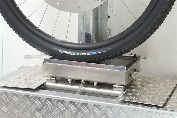 Schwalbe G-One RX Pro (black) 55 road bike tire on a grip test machine