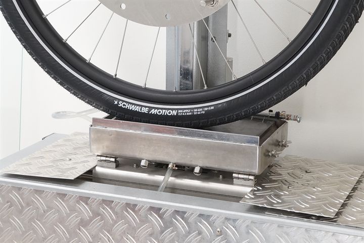 Schwalbe Motion Big Apple road bike tire on a grip test machine