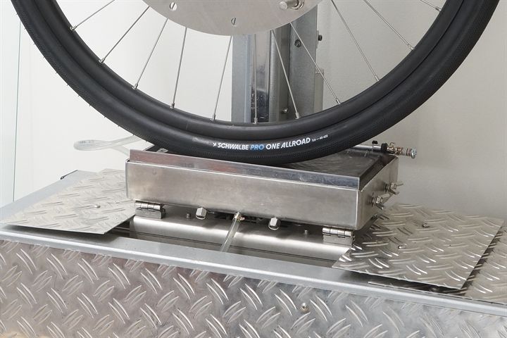 Schwalbe Pro One Allroad road bike tire on a grip test machine