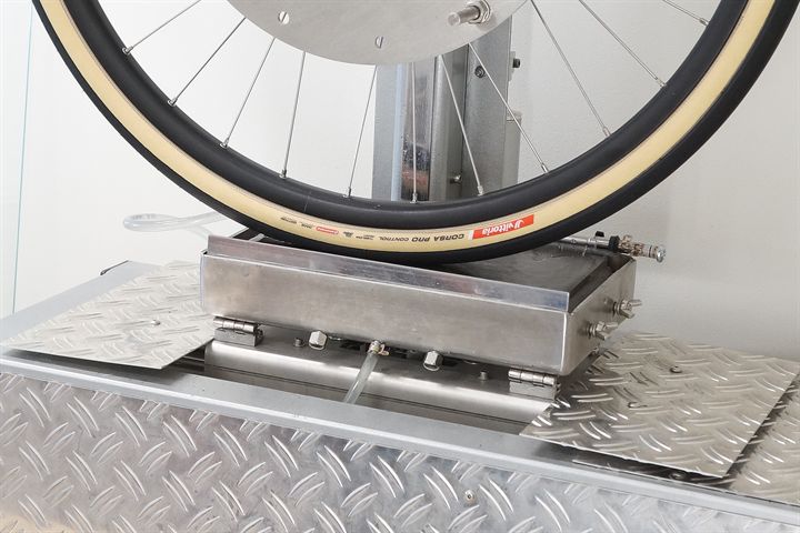 Vittoria Corsa Pro Control TLR road bike tire on a grip test machine