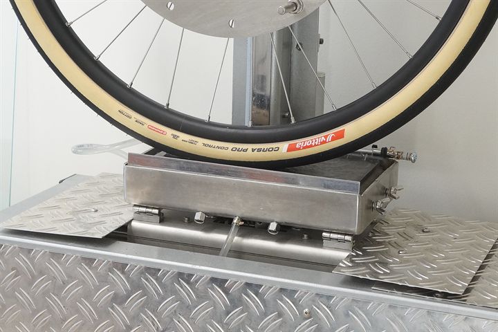 Vittoria Corsa Pro Control TLR road bike tire on a grip test machine