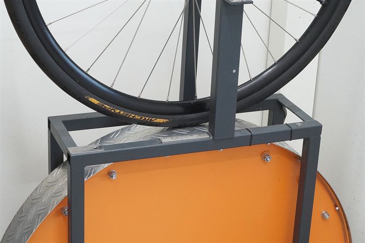 Continental Archetype 30 Continental Archetype 30 road bike tire on a rolling resistance test machine