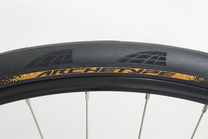 Continental Archetype 30 Continental Archetype 30 road bike tire on a rolling resistance test machine