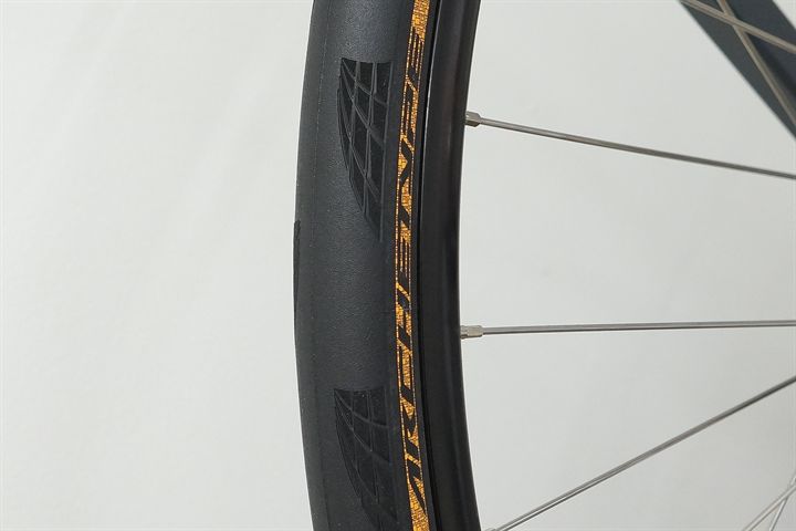 Continental Archetype 30 Continental Archetype 30 road bike tire on a rolling resistance test machine