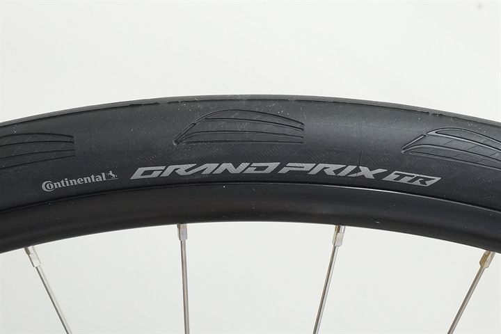 Continental Grand Prix TR 28 Continental Grand Prix TR 28 road bike tire on a rolling resistance test machine