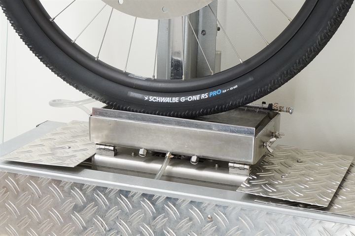 Schwalbe G-One RS Pro (black) 55 road bike tire on a grip test machine