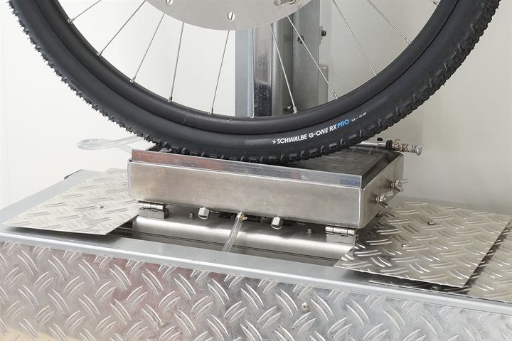 Schwalbe G-One RX Pro Schwalbe G-One RX Pro road bike tire on a grip test machine
