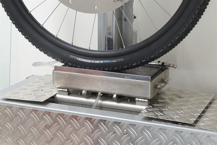 Schwalbe G-One RX Pro Schwalbe G-One RX Pro road bike tire on a grip test machine