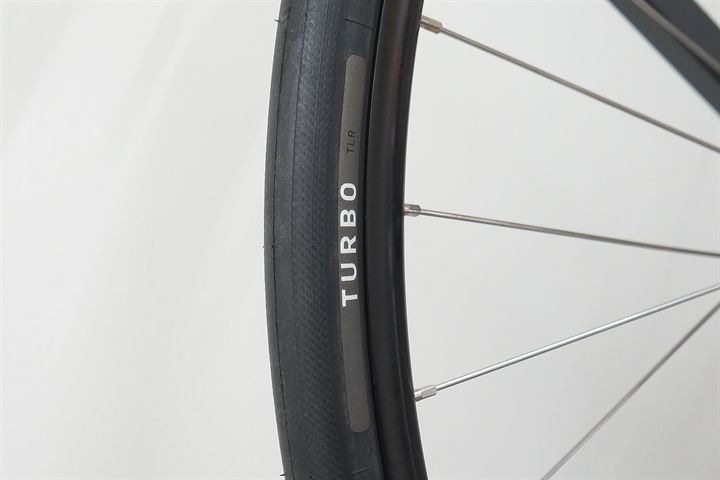 Specialized S-Works Turbo TLR 28 Specialized S-Works Turbo TLR 28 road bike tire on a rolling resistance test machine