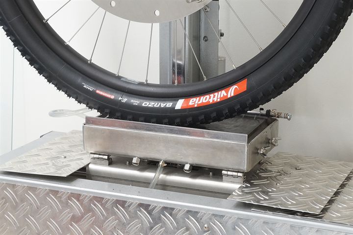 Vittoria Barzo XC Race road bike tire on a grip test machine